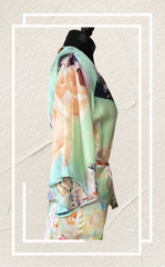 Side view of a Gerard Darel Silk Cardigan showcasing its unique print and luxurious silk fabric.
