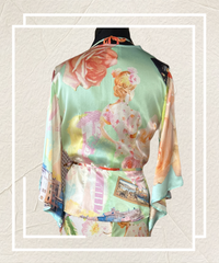 Back view of a luxurious Gerard Darel silk cardigan featuring a colorful floral print and modified Japanese robe style.