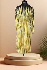 Escada silk dress with a gradient yellow pattern, adjustable waistline, displayed on a mannequin against a soft background.