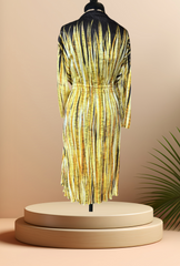 Escada silk dress with a gradient yellow pattern, adjustable waistline, displayed on a mannequin against a soft background.