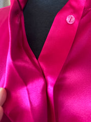 Close-up of Versace Silk Hard Pink Shirt showing luxurious silk fabric and elegant hidden buttons.