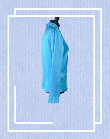 Versace Silk Shirt in blue, showcasing its luxurious fabric and classic cut, perfect for elegant occasions.