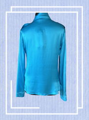 Back view of a luxurious Versace silk shirt in vibrant blue, featuring a classic cut for ultimate elegance.