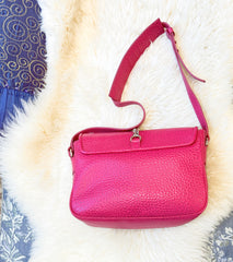 Versace leather bag in vibrant pink with adjustable strap, perfect for luxury style and everyday essentials.