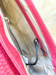 Interior view of a Versace Leather Bag showing the spacious main compartment and zipper pocket.