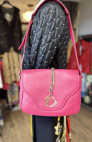 Versace pink leather bag with chain detailing and adjustable strap, perfect for stylish accessorizing.