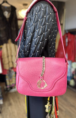 Versace pink leather bag with chain detailing and adjustable strap, perfect for stylish accessorizing.