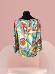 Elegant Seventy Silk Blouse with colorful artistic patterns, showcasing luxurious silk fabric and versatile style.