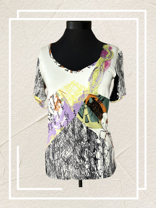 Save the Queen Blouse with abstract art print on a mannequin, showcasing style and comfort.