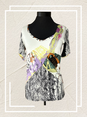 Save the Queen Blouse with abstract art print on a mannequin, showcasing style and comfort.