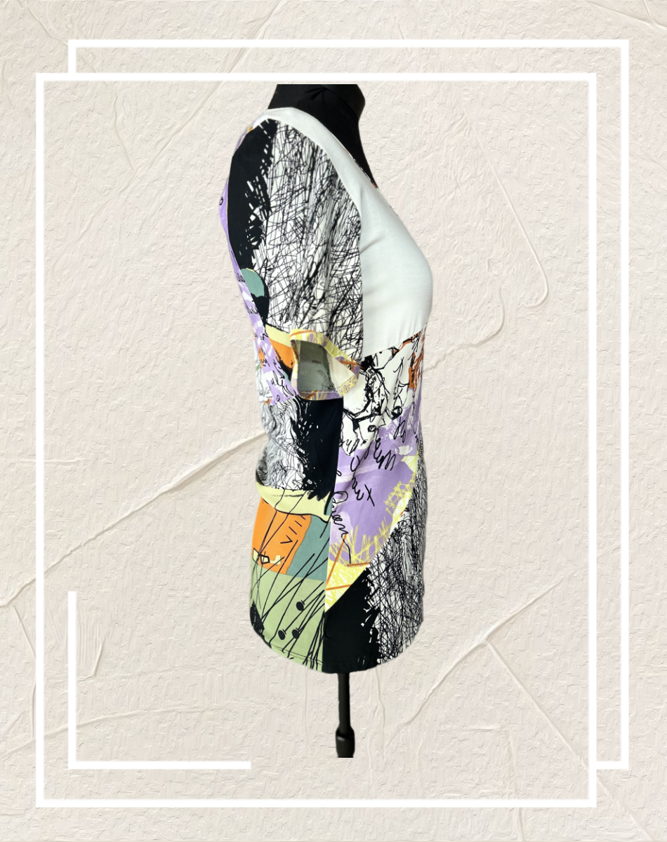 Save the Queen Blouse with unique abstract art print, showcasing style and comfort from a side view.