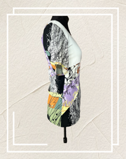 Save the Queen Blouse with unique abstract art print, showcasing style and comfort from a side view.