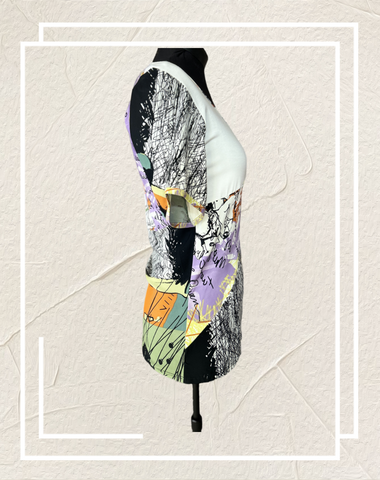 Save the Queen Blouse with unique abstract art print, showcasing style and comfort from a side view.