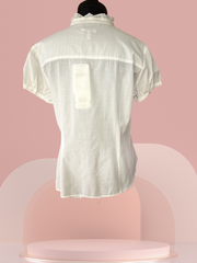 Back view of Escada Cotton Blouse on a display, showcasing its lightweight and classic design.