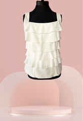 Marccain white tiered blouse on a mannequin, made of 65% cotton and 35% silk, perfect for summer outfits.