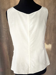 Back view of Marccain white blouse showcasing its tiered design and lightweight fabric for a stylish summer look.