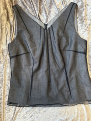 Laurel Vest with a sleek black net outer shell and fitted v-neck design, crafted for style and warmth.