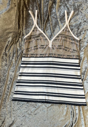 Marccain spaghetti strap vest with striped pattern and lace detail, featuring adjustable straps for a tailored fit.