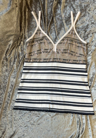 Marccain spaghetti strap vest with striped pattern and lace detail, featuring adjustable straps for a tailored fit.