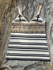 Marccain spaghetti strap vest featuring a stylish striped pattern and delicate lace detail for a feminine touch.