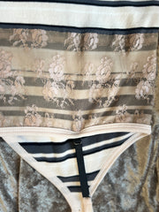 Close-up of Marccain spaghetti strap vest showcasing striped pattern and delicate lace detail for a feminine touch.