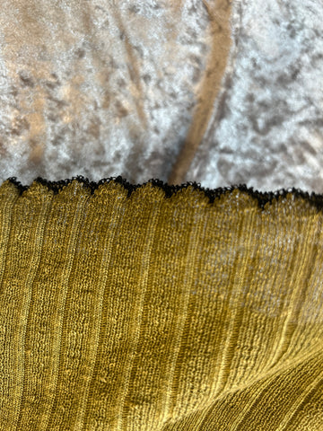 Marccain Spaghetti Strap Vest close-up showing scalloped hem design on a textured background.