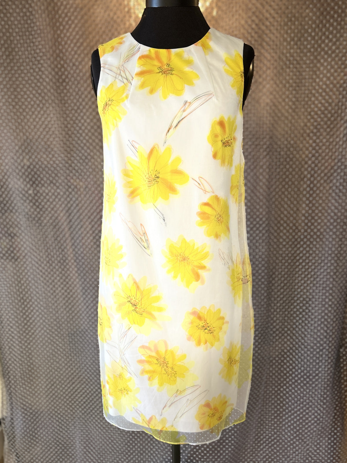 Marccain yellow floral dress featuring a vibrant design, perfect for summer occasions with a stylish and versatile look.
