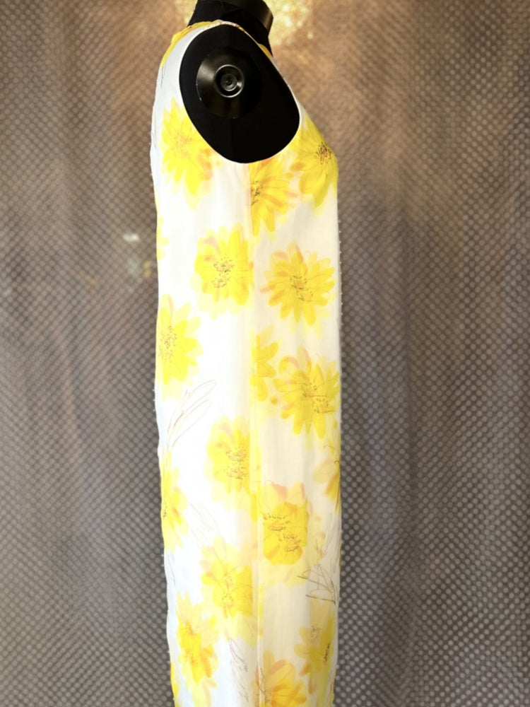 Side view of Marccain Yellow Floral Dress with vibrant yellow floral patterns, showcasing its elegant straight cut design.