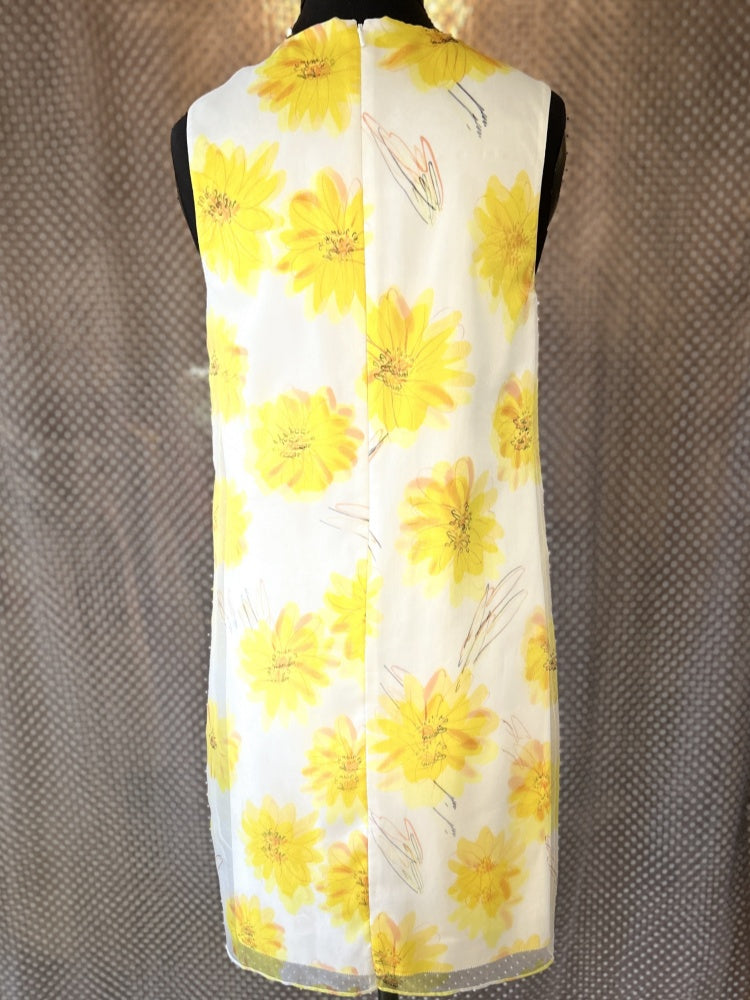 Marccain yellow floral dress with vibrant sunflower design ideal for summer, showcasing a stylish 2-layer cut.