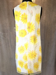 Marccain yellow floral dress with vibrant sunflower design ideal for summer, showcasing a stylish 2-layer cut.