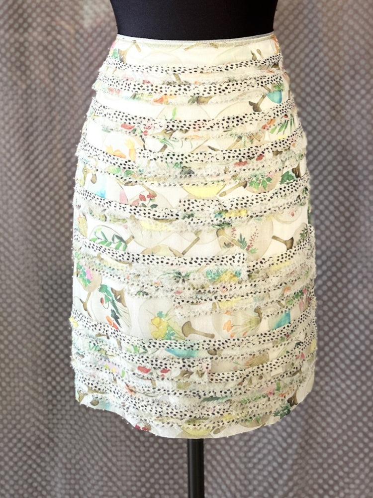 Elegant Marccain Silk Skirt featuring layered design and colorful print, perfect for stylish outfits.