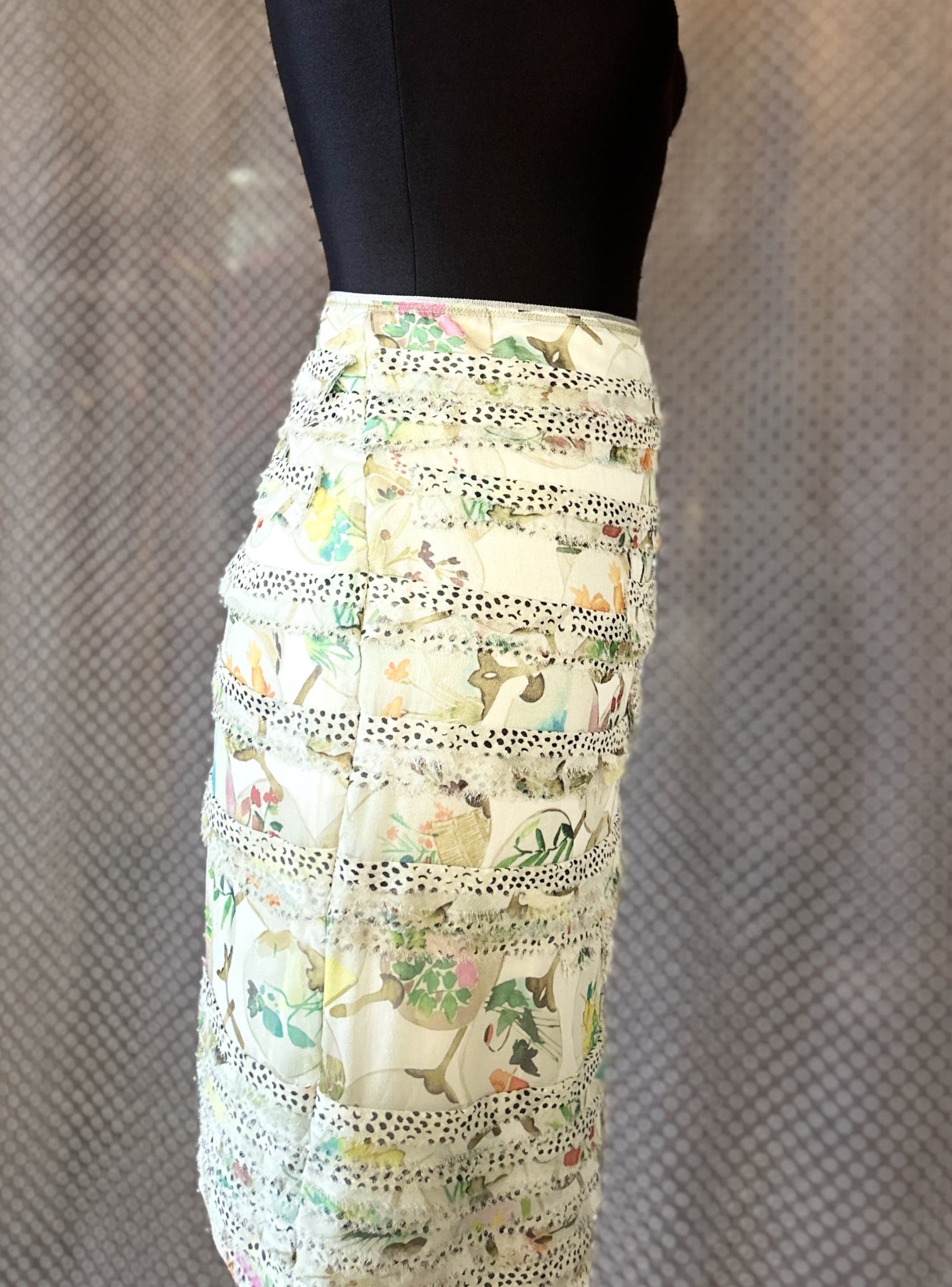 Marccain silk skirt with layered design and floral patterns, showcasing luxury and style for an elegant outfit.