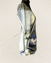 Side view of Save the Queen Blouse featuring water town print and boat neck design, perfect for versatile elegance.
