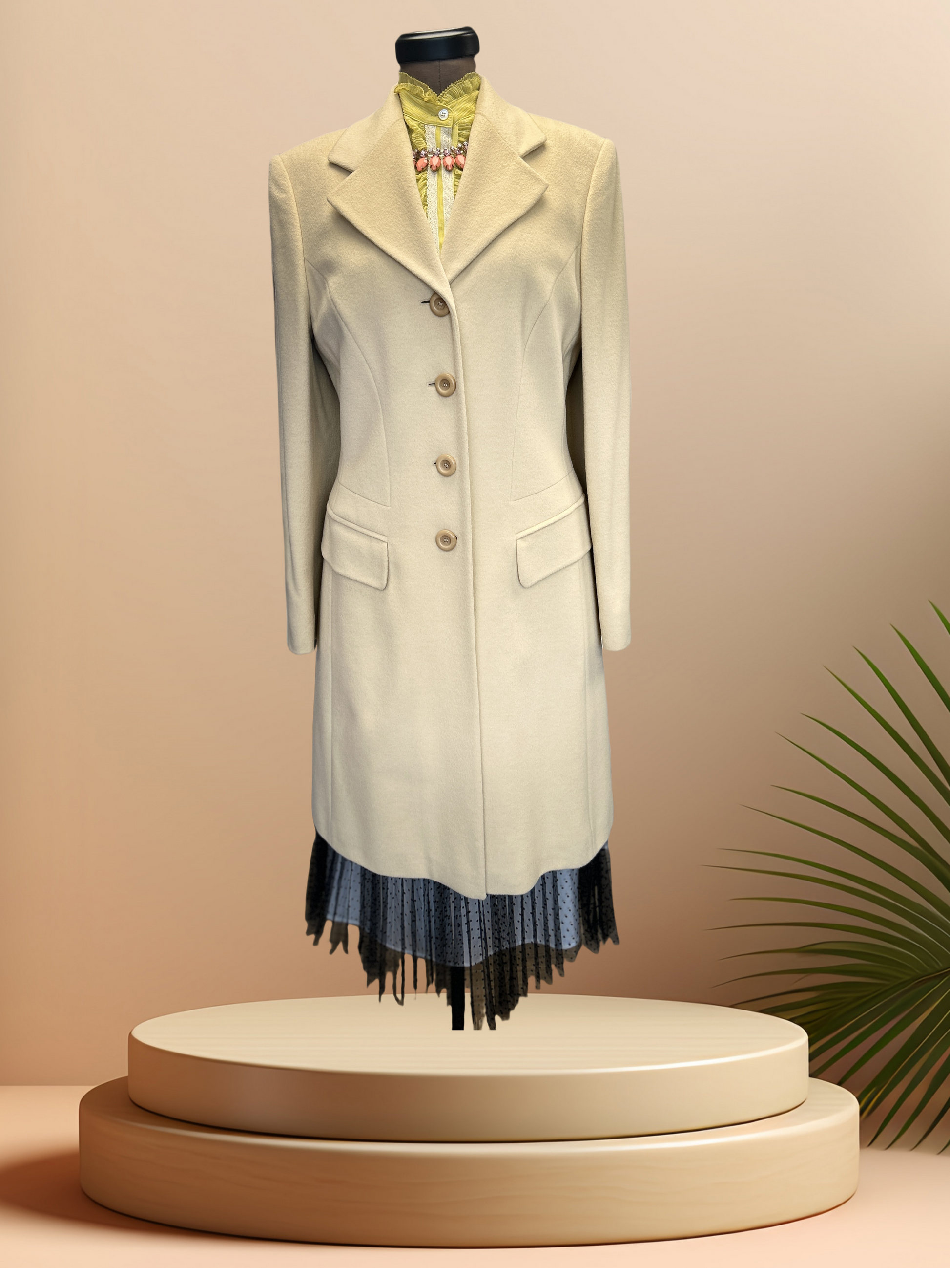 Laurel Creamy Wool Coat displayed on a mannequin, showcasing its elegant design and sophisticated style.