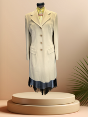 Laurel Creamy Wool Coat displayed on a mannequin, showcasing its elegant design and sophisticated style.