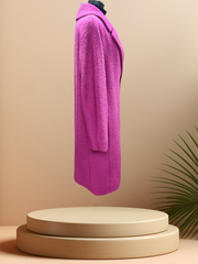Side view of a luxurious Marccain hot pink coat made from virgin wool and alpaca, showcasing its vibrant color and elegant design.