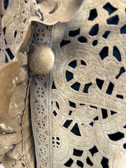 Close-up of Save the Queen Hollow Carving Leather Coat detailing, showcasing intricate hollow carvings and texture.