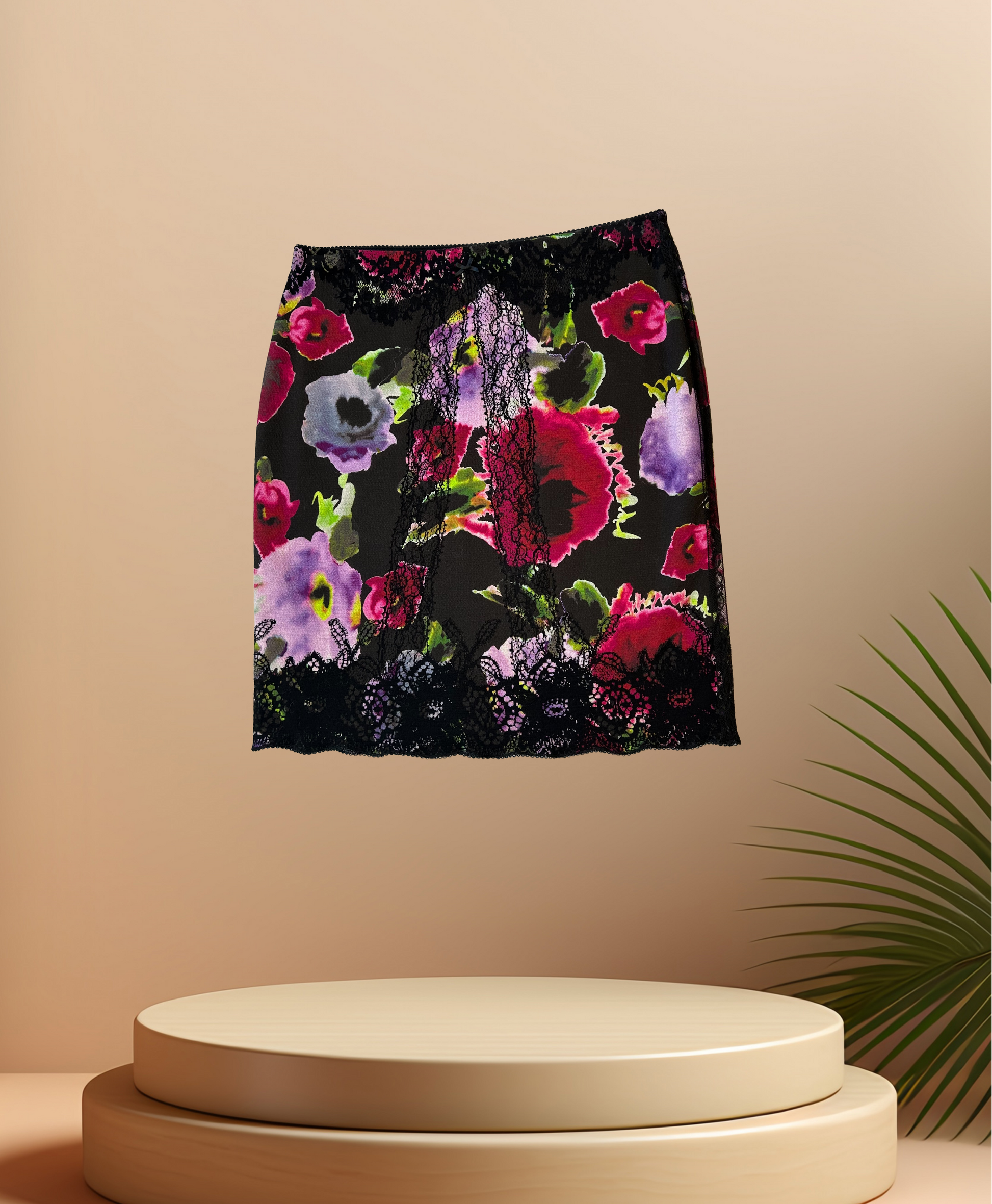 Marccain Print Skirt with vibrant floral design and lace trim, perfect for a stylish spring wardrobe.