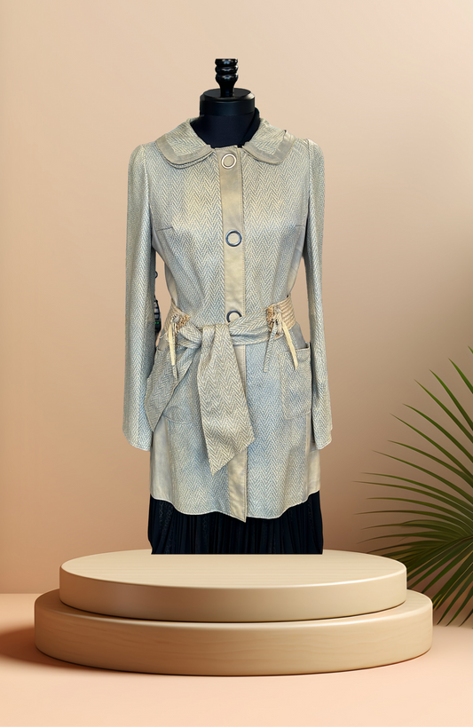 Save the Queen Leather coat displayed on a mannequin, showcasing its stylish design and unique texture.