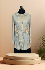 Save the Queen Leather coat displayed on a mannequin, showcasing its stylish design and unique texture.