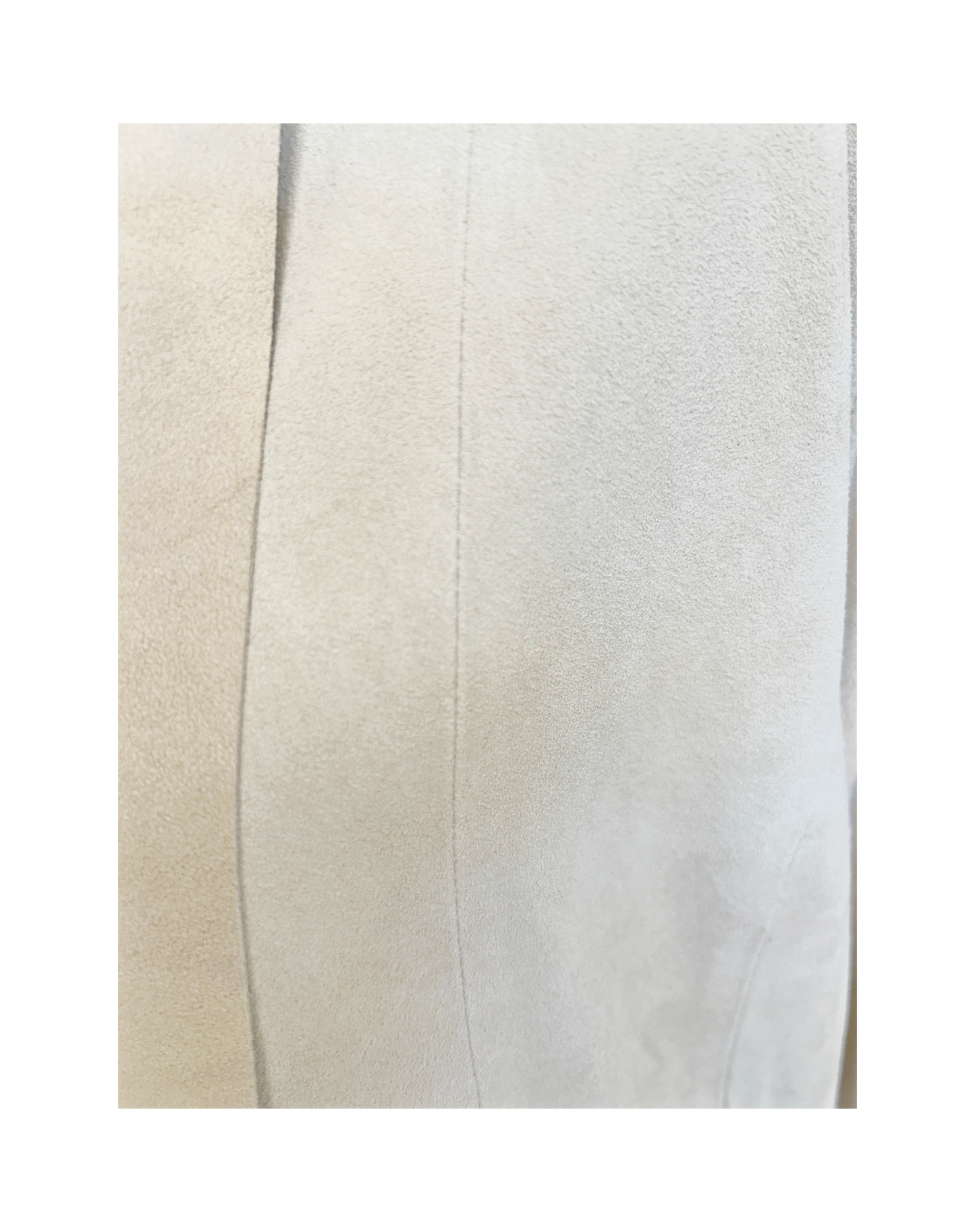 Close-up of the Michael Kors Suede Leather Coat fabric showcasing its soft texture and elegant finish.