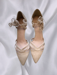 Beige Marccain suede heels with elegant design and lace-up detail, perfect for formal and casual occasions.