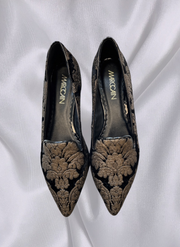 Marccain black ballet flats with exquisite gold embroidery, perfect for elegant and sophisticated occasions.
