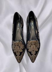 Marccain black ballet flats with exquisite gold embroidery, perfect for elegant and sophisticated occasions.