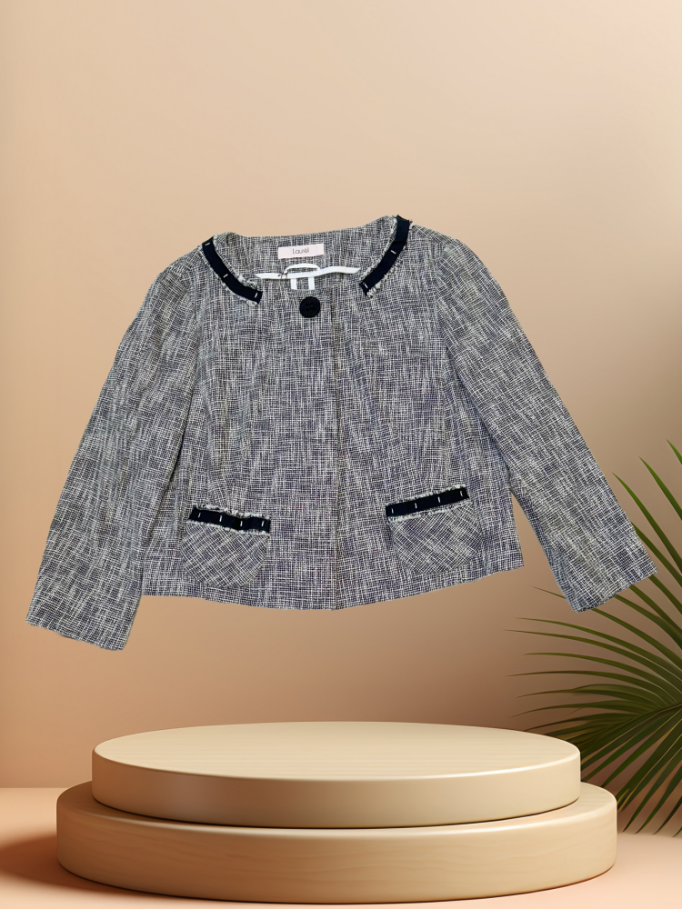 LAUREL SPRING JACKET displayed on a pedestal, featuring stylish design with navy accents, perfect for spring outings.