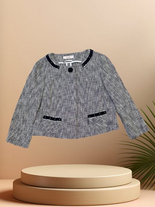 LAUREL SPRING JACKET displayed on a pedestal, featuring stylish design with navy accents, perfect for spring outings.