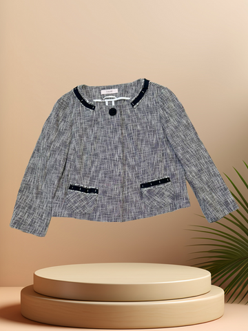 LAUREL SPRING JACKET displayed on a pedestal, featuring stylish design with navy accents, perfect for spring outings.