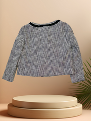 LAUREL SPRING JACKET displayed on a pedestal, showcasing its stylish design and versatile spring wardrobe essential.