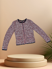 Marccain spring jacket featuring a vibrant mix of blue and red threads, perfect for stylish spring wardrobe.