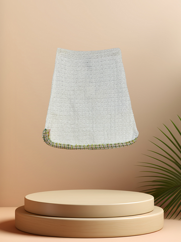 Marccain white thread knitted skirt on display, featuring a breathable design and above-knee length for spring and summer fashion.